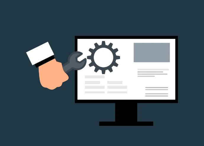 A conceptual illustration showing a hand holding a wrench next to a computer monitor. The monitor displays a large gear icon and simplified website wireframe elements, symbolizing technical support or web maintenance.